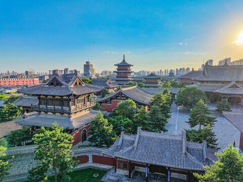Aerial photography of Huayan Temple in Datong, Shanxi, China on a sunny summer day with fiery clouds