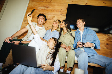 Team of creative professionals mixing work and fun while taking a selfie together