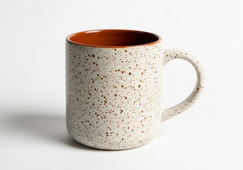 Speckled ceramic mug with brown interior, isolated on white background
