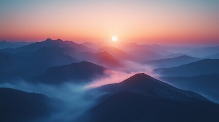 Sunrise over misty mountain range with colorful sky and layers of blue and purple peaks at dawn, creating a serene and majestic natural landscape scene