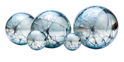 Collection of cracked glass spheres with sharp fractures isolated on a transparent background