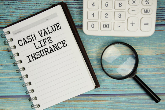 Cash Value Life Insurance text on notepad with magnifying glass and calculator on wooden background