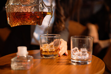 Closeup businessmen holding a glass of whiskey
