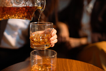 Closeup businessmen holding a glass of whiskey