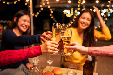 Asian women are having a night drinking party with beautiful lights.