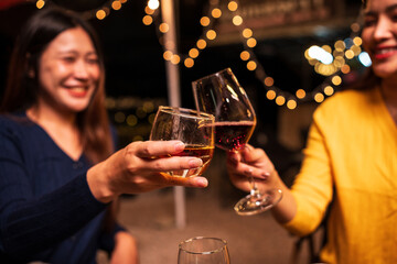 Group of Asians are having a celebration at a restaurant with drinks.