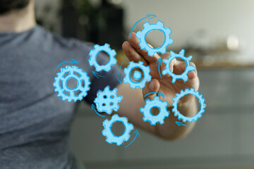 Abstract image of a hand interacting with digital gears. Perfect for concepts of teamwork, workflow, and strategic planning.