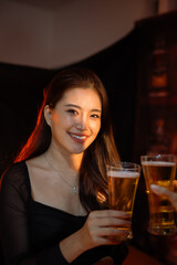 food and drink male friends are happy drinking beer and clinking glasses at a bar or pub.