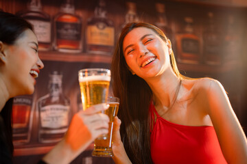  Friends having fun clinking glasses with beer
