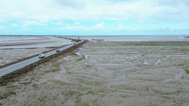 Aerial view of oyster farms at low tide near the Passage du Gois, Noirmoutier Island, France. Long rows of oyster beds and water channels create a unique landscape, showcasing traditional oyster
