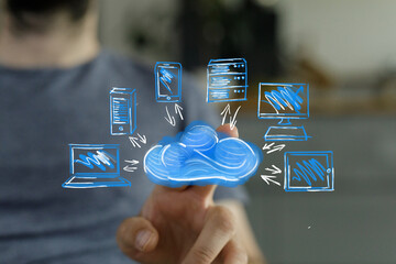 Man interacts with cloud computing, connecting devices. Digital technology concept.