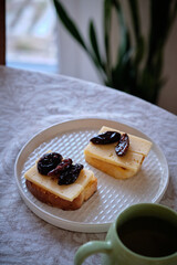 toast with cheese, sun-dried plum, homemade bread.