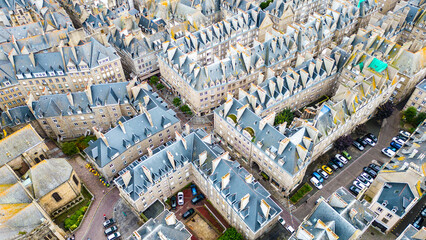 Aerial view of Saint-Malo, Brittany, France. Historic walled city on the English Channel with sandy...