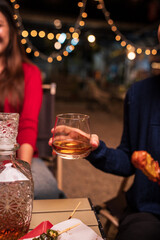 Celebrate whisky at an intimate party at a camping restaurant. A group celebration.	