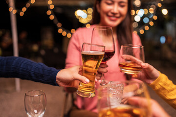 young couple celebrating with champagne at night