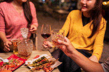 Celebrate whisky at an intimate party at a camping restaurant. A group celebration.