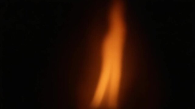 Animation of fire burning. Flame with black smoke appears on a black background and burns until the end of the . Vertical composition. Alpha Channel.