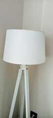 beautiful lamp with wood tripod decoration in a room