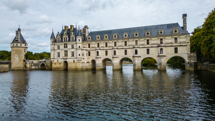 Aerial view of Château de Chenonceau, one of the most famous Loire Valley castles in France. Renaissance architecture spanning the River Cher, surrounded by lush forests and beautifully landscape