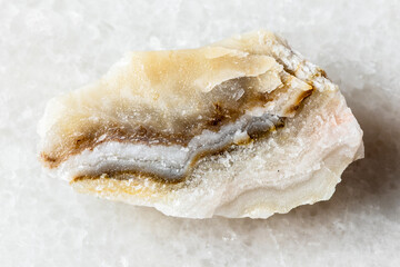 sample of rough shaitan perelivte mineral on white