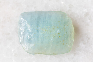 sample of tumbled aquamarine mineral on white