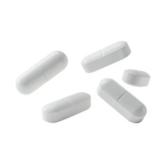 Four white oval pills and one small round tablet isolated on a black surface macro shot transparent background