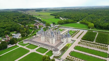Aerial view of Château de Chambord, the largest and most majestic castle of the Loire Valley in France. Renaissance masterpiece with distinctive towers and intricate roofline, surrounded by vast park