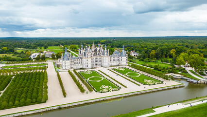 Aerial view of Ch&acirc;teau de Chambord, the largest and most majestic castle of the Loire Valley in France. Renaissance masterpiece with distinctive towers and intricate roofline, surrounded by vast park