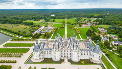 Aerial view of Ch&acirc;teau de Chambord, the largest and most majestic castle of the Loire Valley in France. Renaissance masterpiece with distinctive towers and intricate roofline, surrounded by vast park
