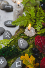 Runes on stones among autumn leaves
