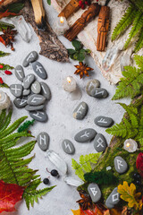 Runes on stones among autumn leaves