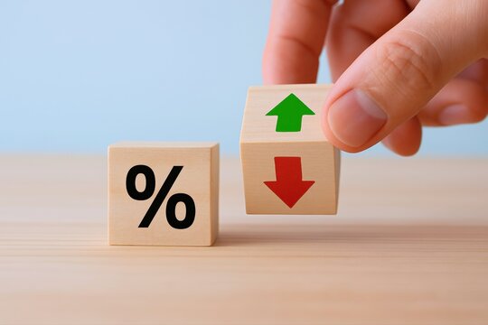 Hand Adjusts Interest Rate, Choosing Between Green Growth or Red Decline on simple wooden cubes