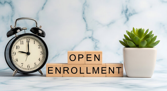 Open enrollment period reminder with vintage alarm clock and potted plant