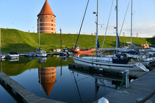 Klaipėda, Lithuania &ndash; August 1, 2025: Newly Built Tower of Klaipėda Castle, Courtyard, Moat, and Boats