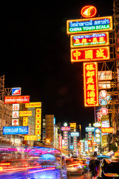 CHINATOWN, BANGKOK, THAILAND - October 26, 2025 : View on people and traffic pass by in Chinatown Bangkok Thailand ,Cars and Street food on Yaowarat road.