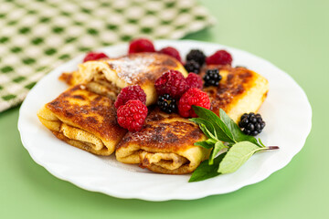 sweet homemade pancakes with cottage cheese and berries
