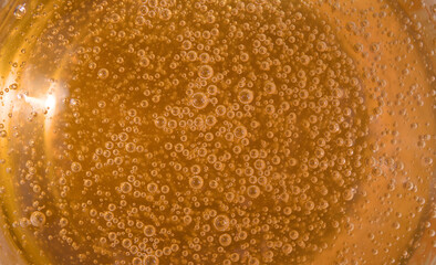 Honey close-up background with bubbles