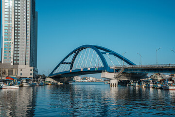 Sokcho harbor with fishing boats and modern skyscrapers, South Korea