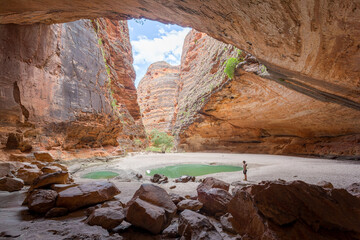 A person explores a stunning natural gorge in Western Australia..