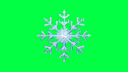 Fototapeta premium Intricate snowflake on green screen background