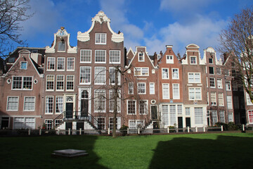 Fototapeta premium old brick habitation buildings (beguinage) in amsterdam in the netherlands 