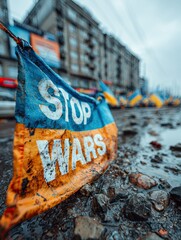 Ukrainian flag with slogans "Stop wars"