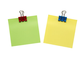 Two colorful sticky notes one green and one yellow held by binder clips isolated on transparent background