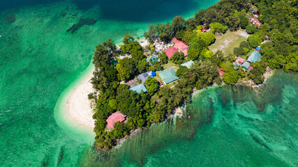 Aerial drone of Manukan island with a beautiful sandy beach. Tunku Abdul Rahman National Park. Kota Kinabalu, Sabah, Malaysia.