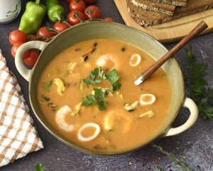 Seafood soup. Alaska pollock, mussels, king prawns and squid. Leek, tomatoes, garlic, onions, chillies, fresh herbs and spices.