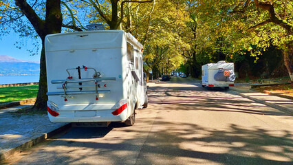 car caravan under yellow autumn trees