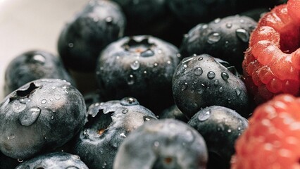 Blueberry berry background with water drops. Macro. Fresh blueberry background. Drops of water on ripe blueberries. Background of freshly picked blueberries, close-up. Blue blueberries close-up.