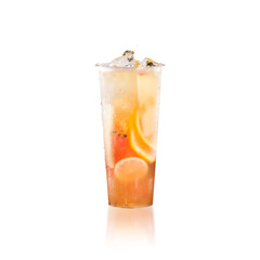 Bright refreshing citrus fruit tea in clear cup, isolated cold drink with lemon, orange and grapefruit 