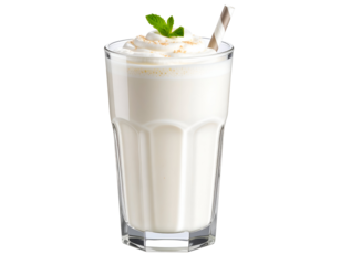 A refreshing glass of creamy beverage topped with whipped cream and mint leaves, perfect for warm days and indulgence.
