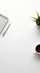 Clean White Desk Setup with Notebook, Pen, Plant, and Coffee Mug
